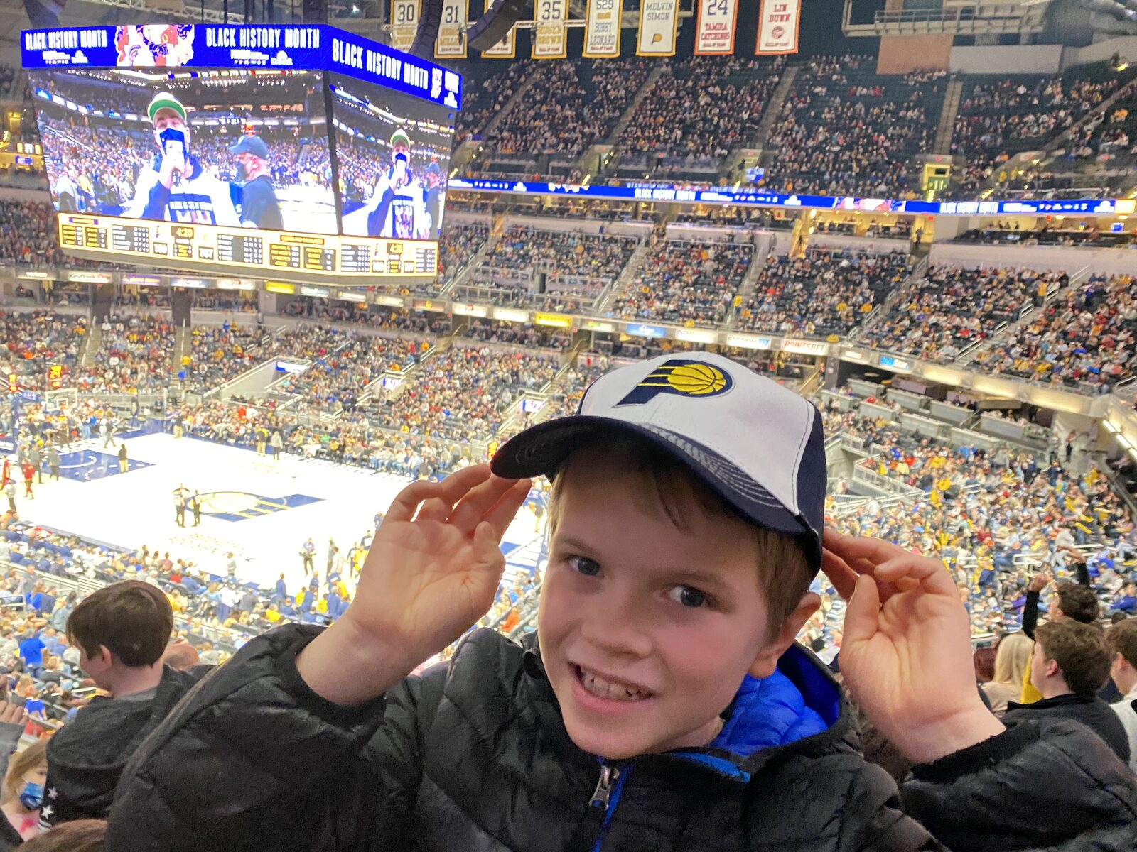 Tim's son in a Pacers cap at a game in Indianapolis