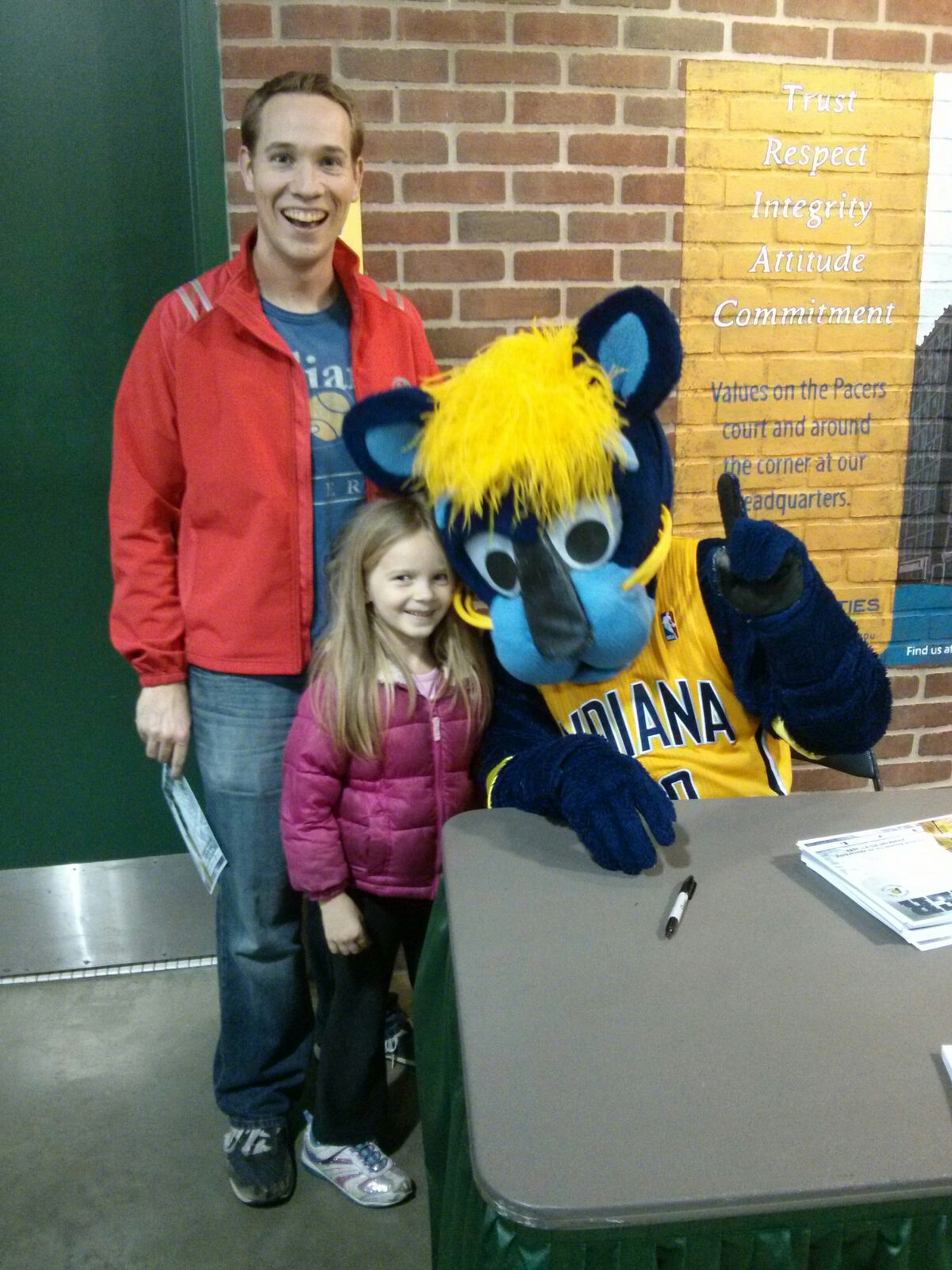 Tim Flint and his daughter meeting the Pacers mascot